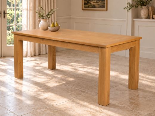 Caravella 180cm oak dining table styled beside French doors in a welcoming farmhouse dining room