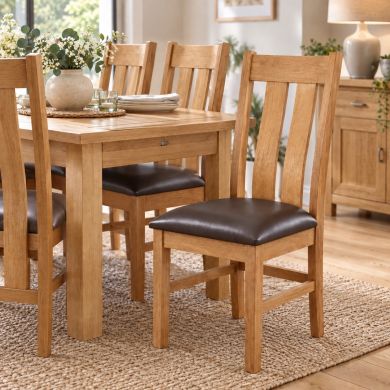 Churchill Dark Brown Leather Solid Oak Dining Chair with curved slatted oak back and dark brown leather seat in a stylish dining room