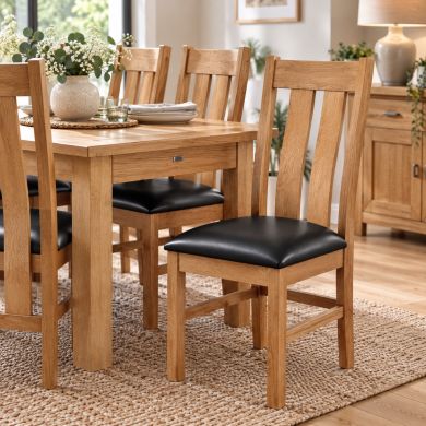 Churchill Black Leather Solid Oak Dining Chair – pair shown in dining room