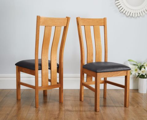 Churchill Black Leather Solid Oak Dining Chair – pair shown in dining room
