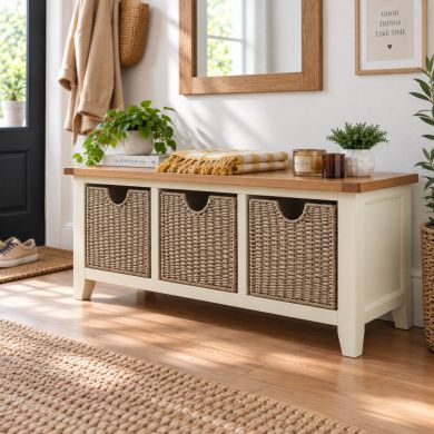 Country Cottage cream painted oak shoe storage bench with three woven baskets in a stylish hallway setting