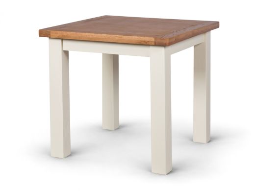 Angled view of the Country Oak 80cm square dining table showing its oak top and cream painted legs on a white background