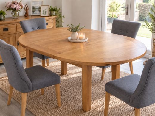 Country Oak round extending dining table fully extended to 145cm in a bright dining room