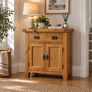 Country Oak Small 80cm Fully Assembled Sideboard with two drawers, two cupboard doors and rustic metal handles in a warm neutral living space