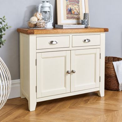 Country Cottage 100cm cream painted assembled oak sideboard with two drawers, two cupboards and a natural oak top.