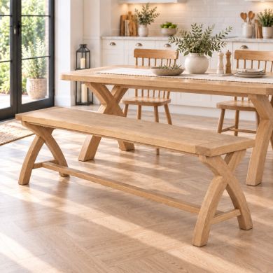 Doveridge 160cm whitewash solid limed oak cross-leg bench in a bright modern country kitchen and dining room.