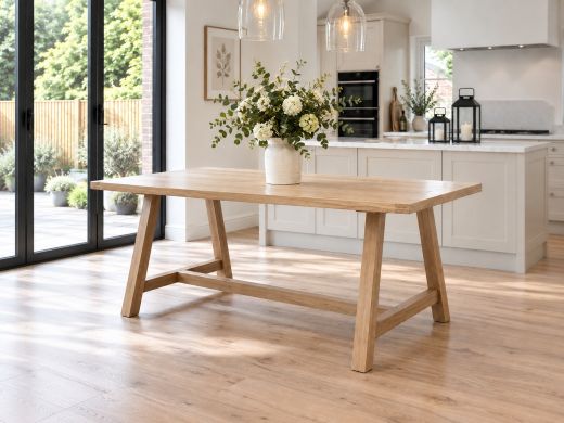 Doveridge 180cm whitewash limed oak trestle dining table in a bright contemporary kitchen