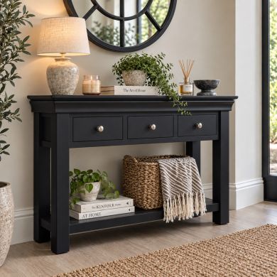 Toulouse Black Painted 3 Drawer Large Assembled Console Table styled in a modern hallway with lower shelf storage