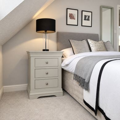Toulouse Grey painted grande large 3 drawer bedside table with chrome knobs in a stylish bedroom setting