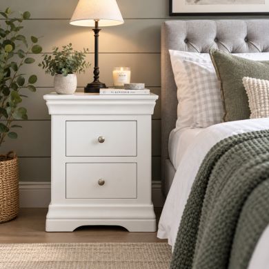 Toulouse white painted 2 drawer fully assembled bedside table in a stylish bedroom setting