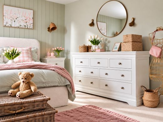 Toulouse white painted large 3 over 4 assembled chest of drawers in a bright stylish bedroom setting