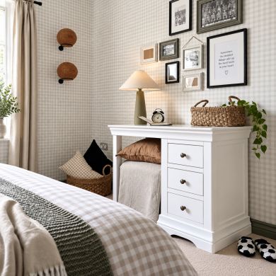 Toulouse White Painted Single Pedestal Dressing Table and Home Office Desk styled in a cosy bedroom