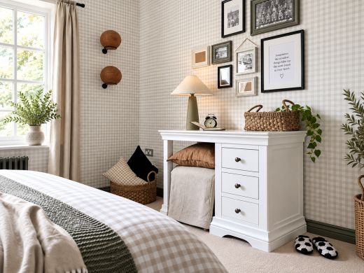 Toulouse White Painted Single Pedestal Dressing Table and Home Office Desk styled in a cosy bedroom