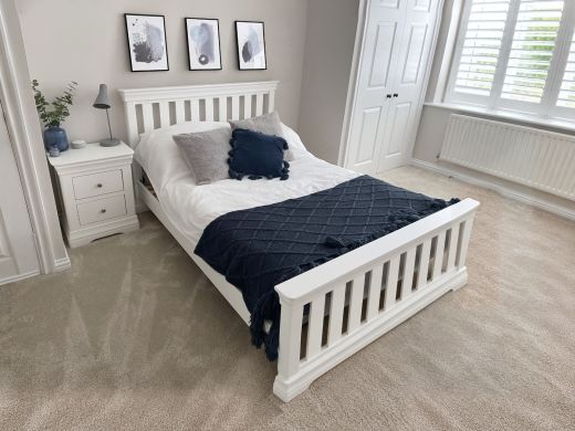 Toulouse white painted 4'6 Double Bed size slatted bed with navy bedding in a bright neutral bedroom