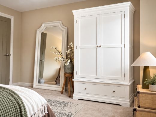 Toulouse Brilliant White Painted Double Wardrobe with Drawer in a neutral bedroom with full-length mirror