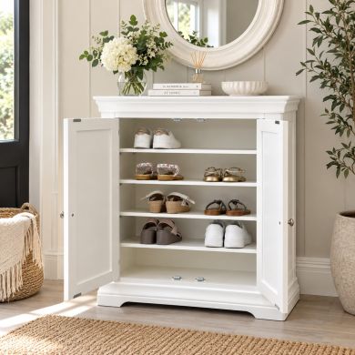 Toulouse White Painted Assembled Shoe Rack Cupboard with open doors showing internal shoe storage shelves in a bright hallway lifestyle setting