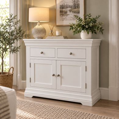 Toulouse 100cm white painted assembled sideboard with two drawers, two cupboard doors and chrome knobs and hinges in a stylish neutral living room