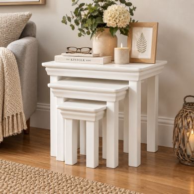 Toulouse White Painted Assembled Nest of 3 Tables styled in a neutral living room setting