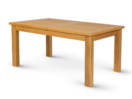Lichfield double extending oak dining table fully extended to 240cm beneath pendant lights in a dining room