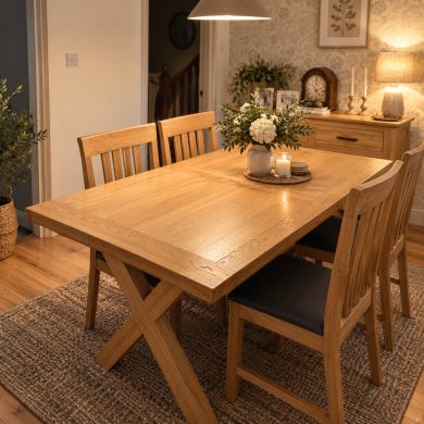 Provence 1.6m to 2.0m Extending Cross Leg Oak Dining Table with square corners in a warm styled dining room