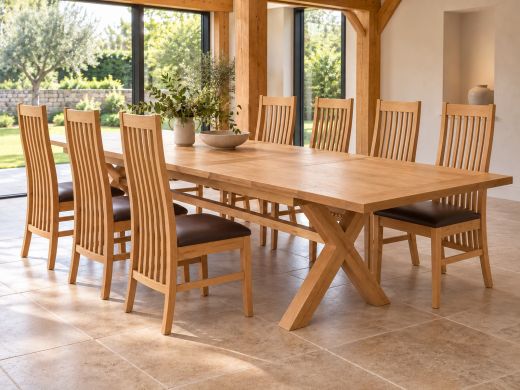 Provence 340cm extending oak dining table with brown-pad Lichfield chairs in an oak-beamed country dining room