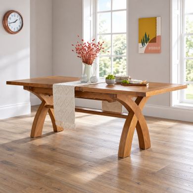 180cm to 230cm Country Oak cross leg extending dining table in a bright contemporary dining room