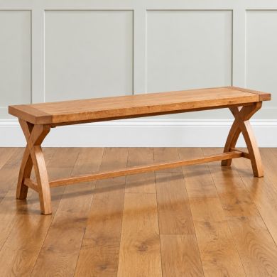 Country Oak 160cm solid oak cross leg dining bench with stretcher support in a bright panelled room
