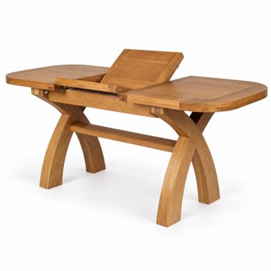 Country Oak 130cm to 180cm X-leg extending dining table showing the butterfly extension mechanism opening