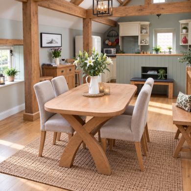 Country Oak 1.4m cross leg dining table with oval corners in a bright barn-style dining room